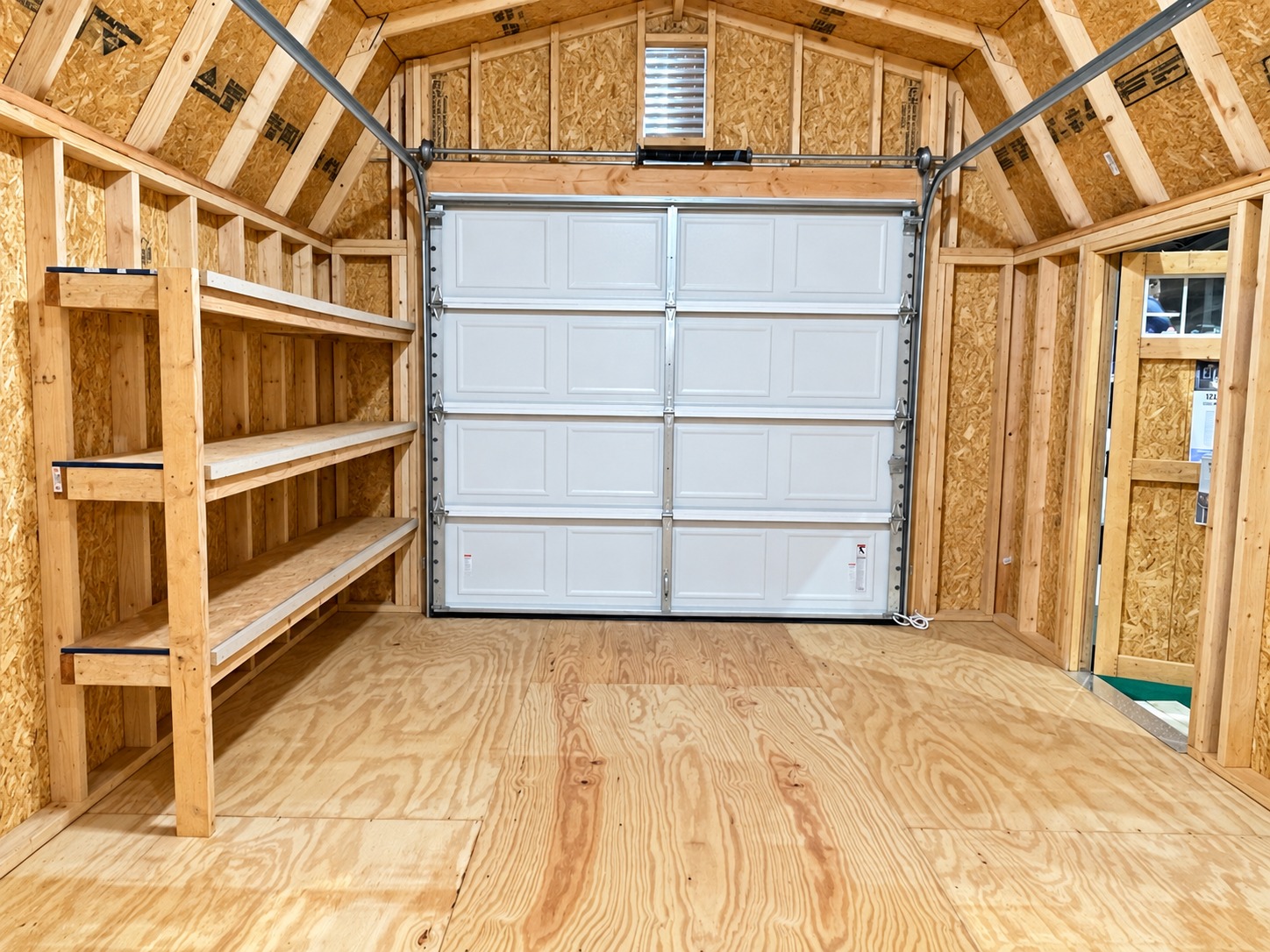 Interior looking toward the garage door of garage display 51126