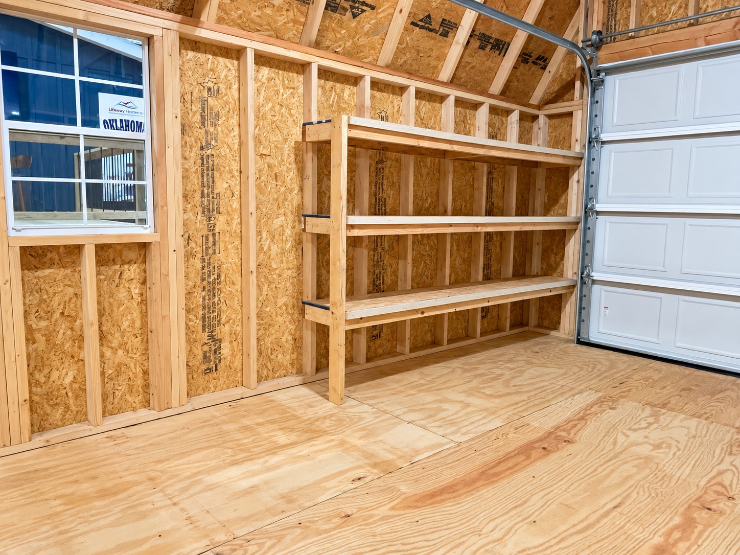 Built-in shelves beside the window of garage display 51126